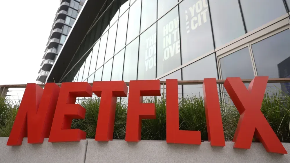 Netflix ad-supported tier expansion represented on a world map