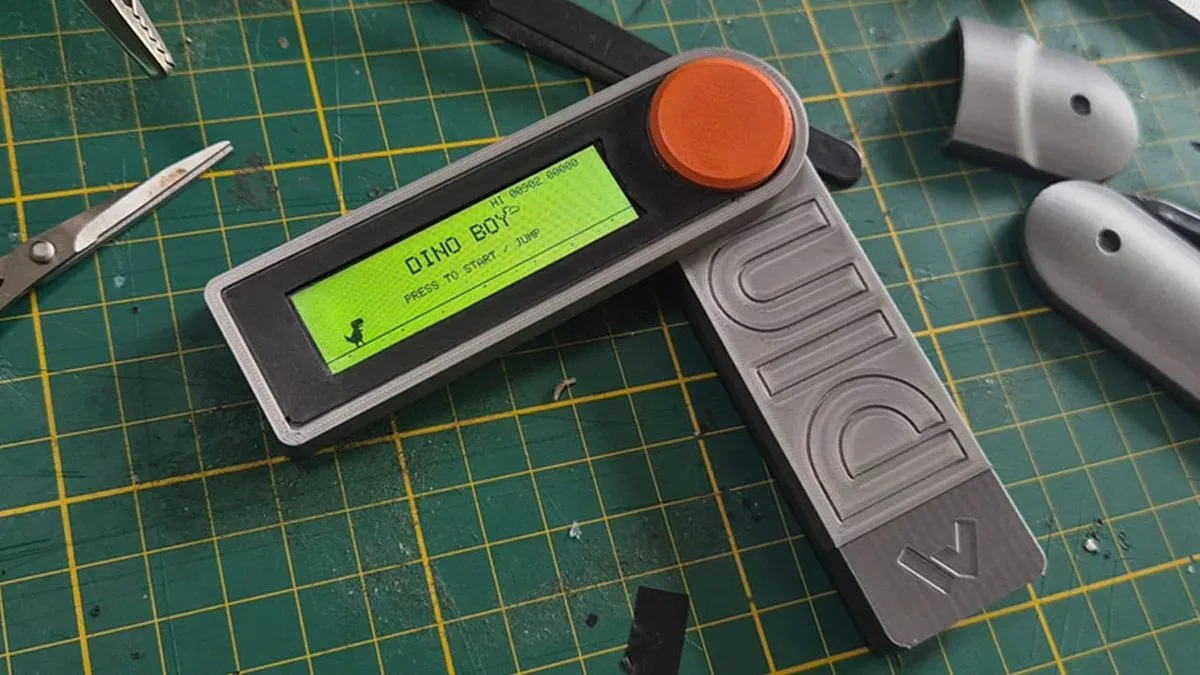 Dino Boy fold-out one-button handheld with its screen raised on a hinge