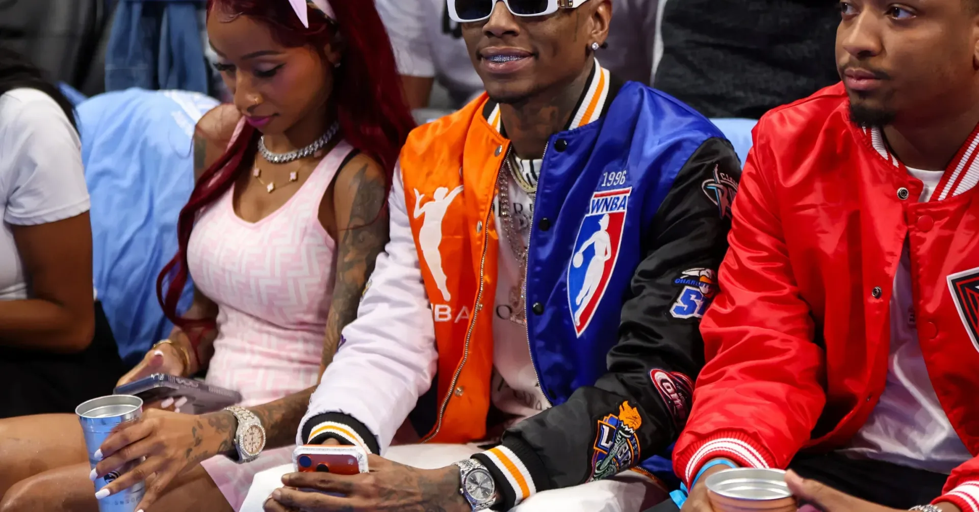 Soulja Boy speaking into a microphone during a public appearance
