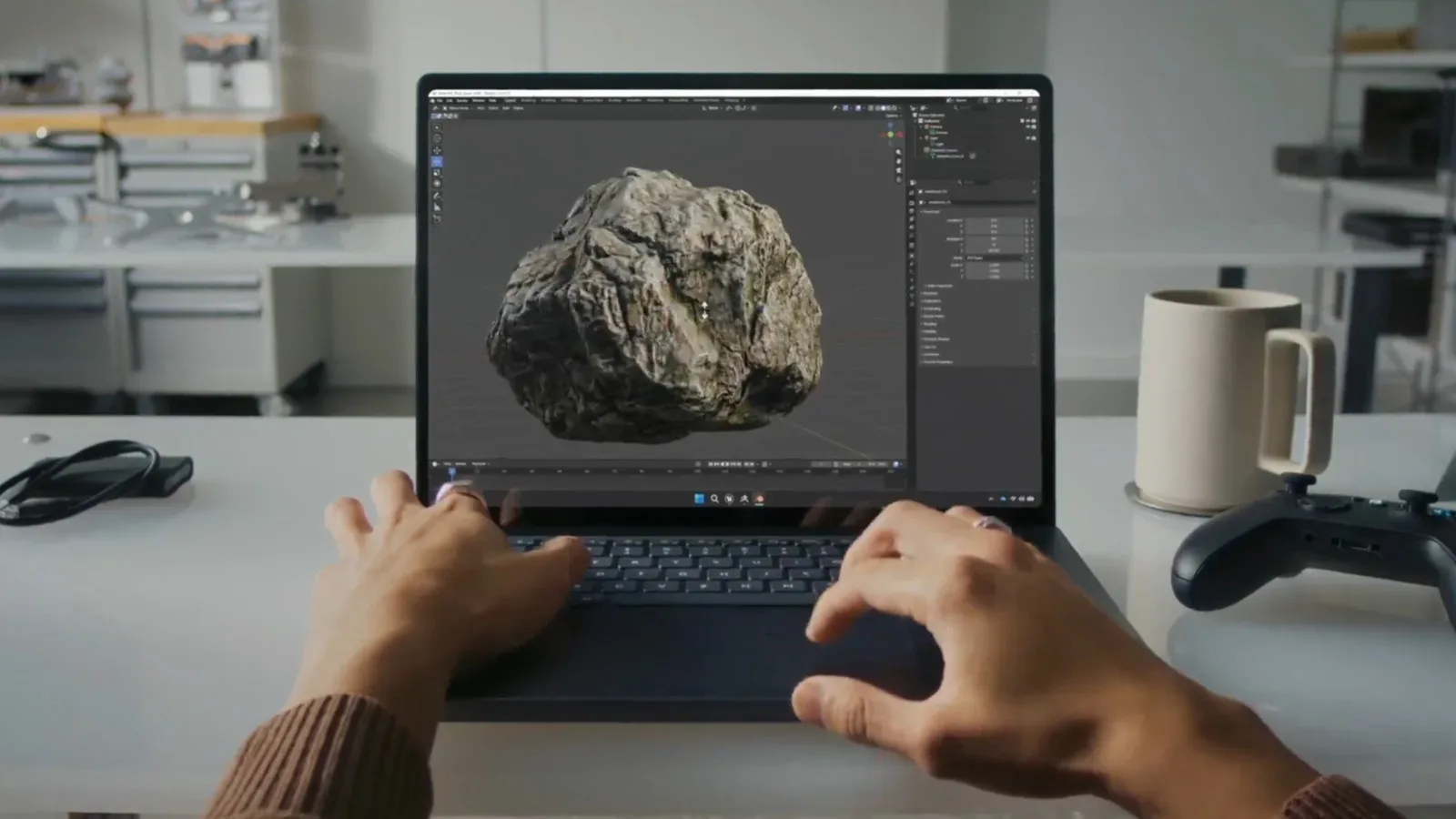 Microsoft Surface Laptop Ultra open on a desk with its 15-inch Mini-LED display visible