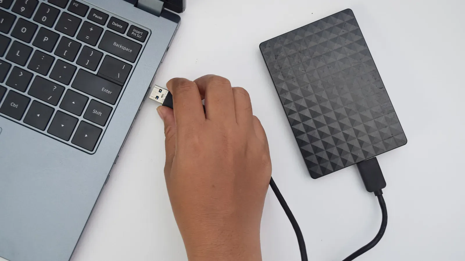 External hard drive resting unplugged after an accidental drop