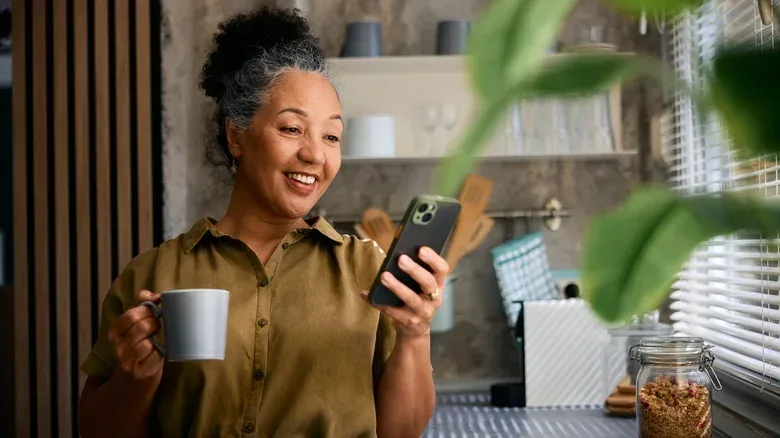 Woman enjoying content on her phone.