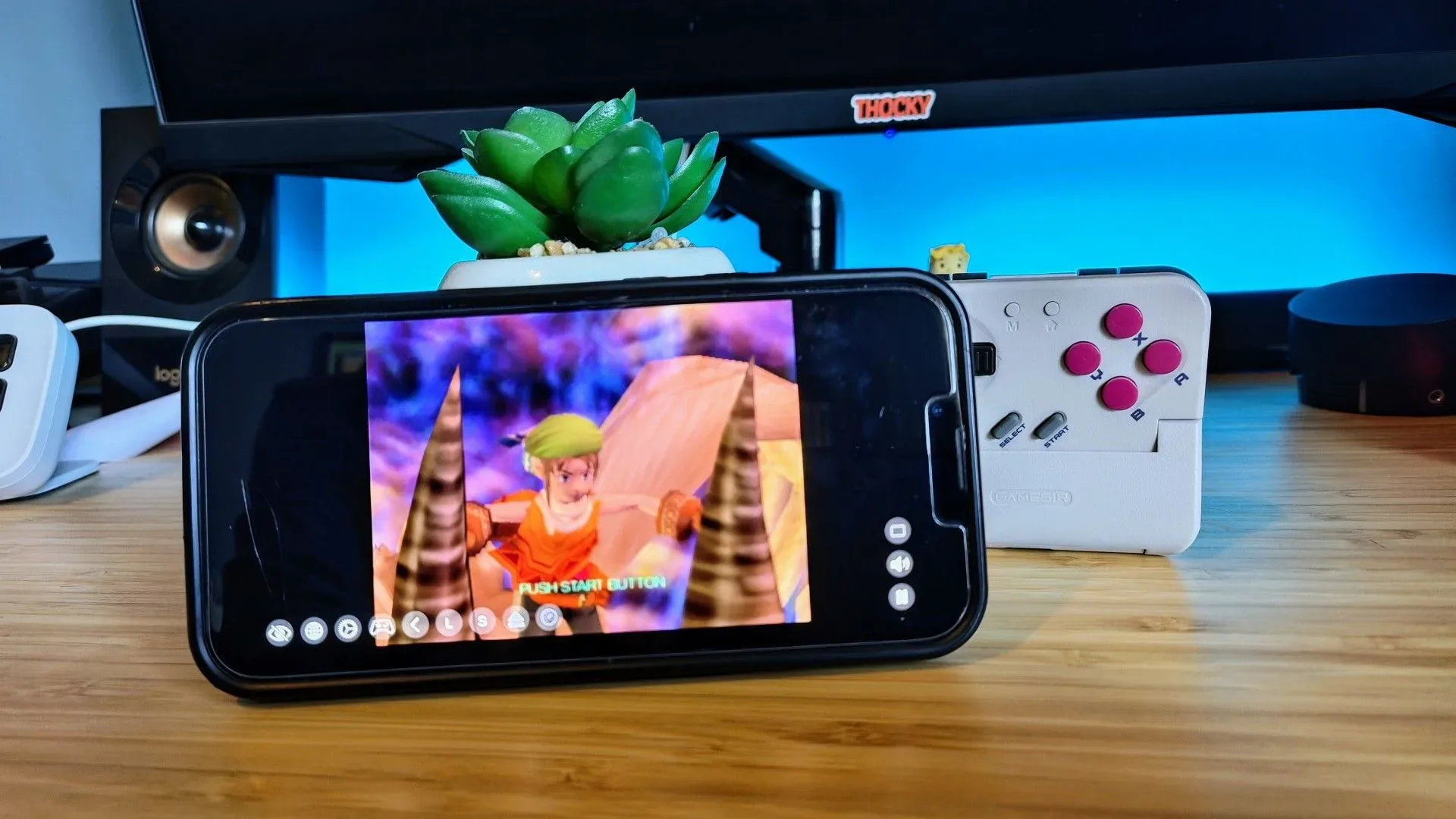 Abxylute M5 and M6 slide-up mobile controller concept with phone-mounted controls