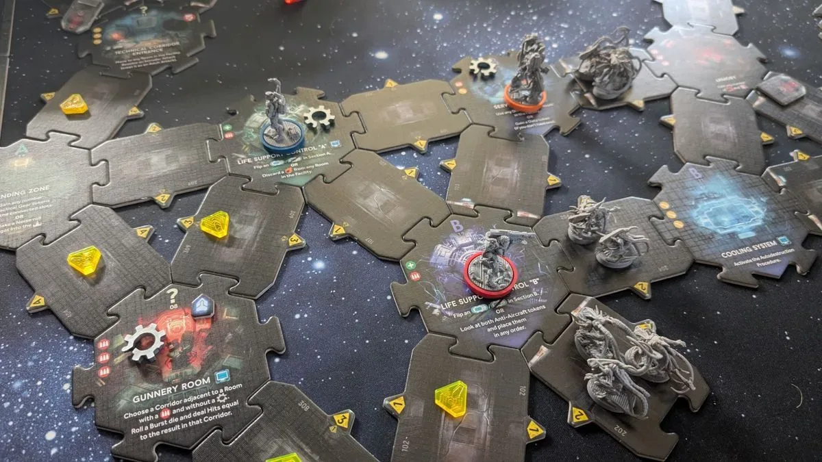 Nemesis: Retaliation pieces, board tiles, and tokens on a gaming table with a starry effect