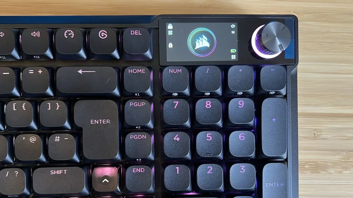 Close up on display and control dial in the top right corner of the Corsair Vanguard Air 99 Wireless gaming keyboard