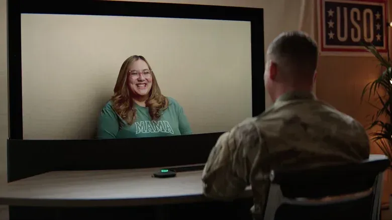Life-size three-dimensional video call display connecting a service member with family