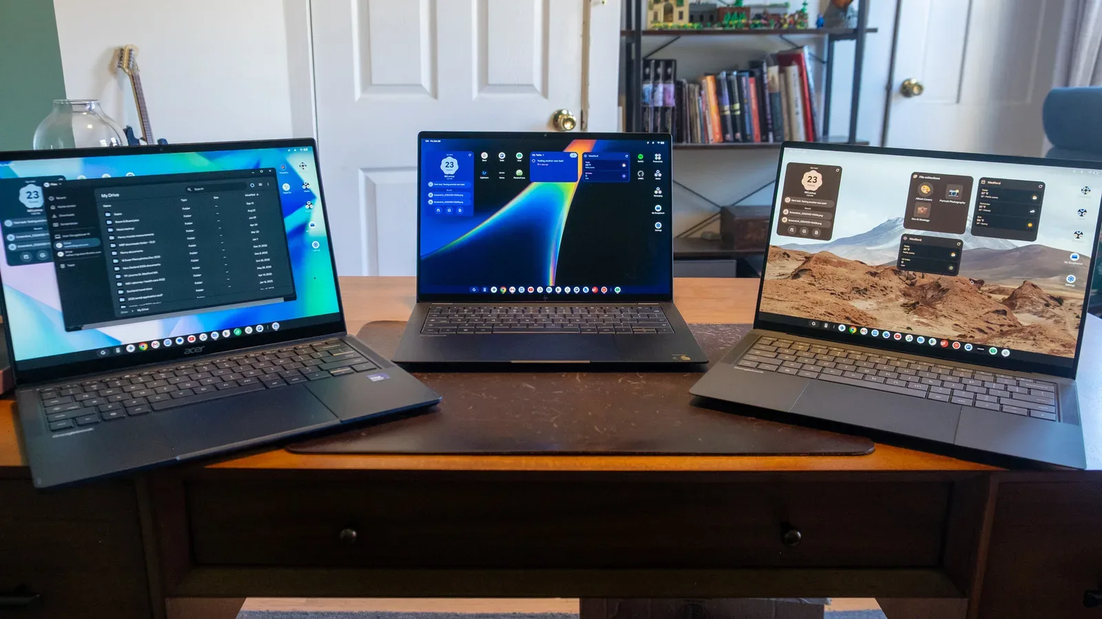 A slim Googlebook laptop showing an Android-powered desktop and taskbar