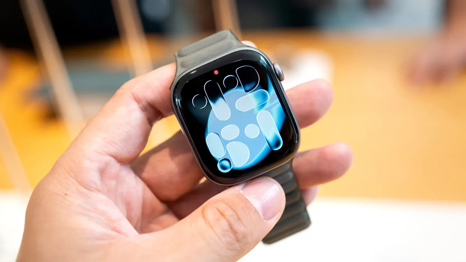 Apple Watch displaying its power menu beside the side button and Digital Crown