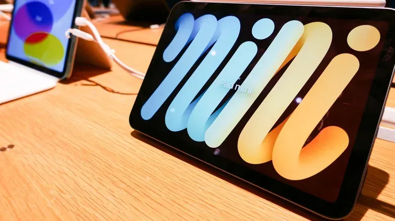 Apple Pencil beside a compact iPad Mini