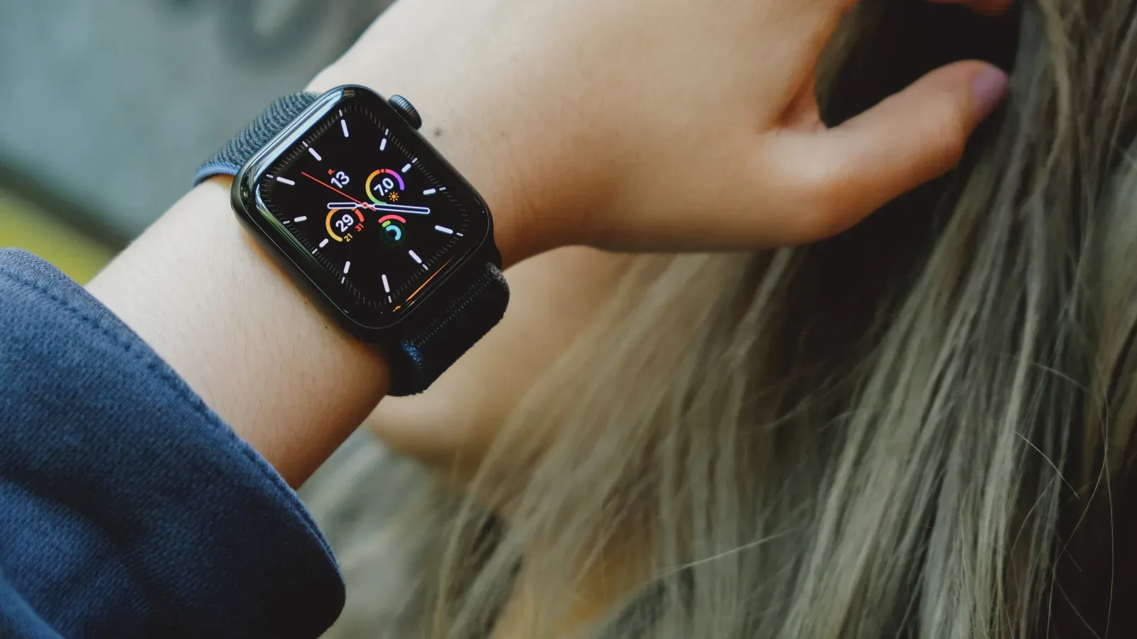 Apple Watch SE 3 displaying a watch face beside AppleCare+ coverage information