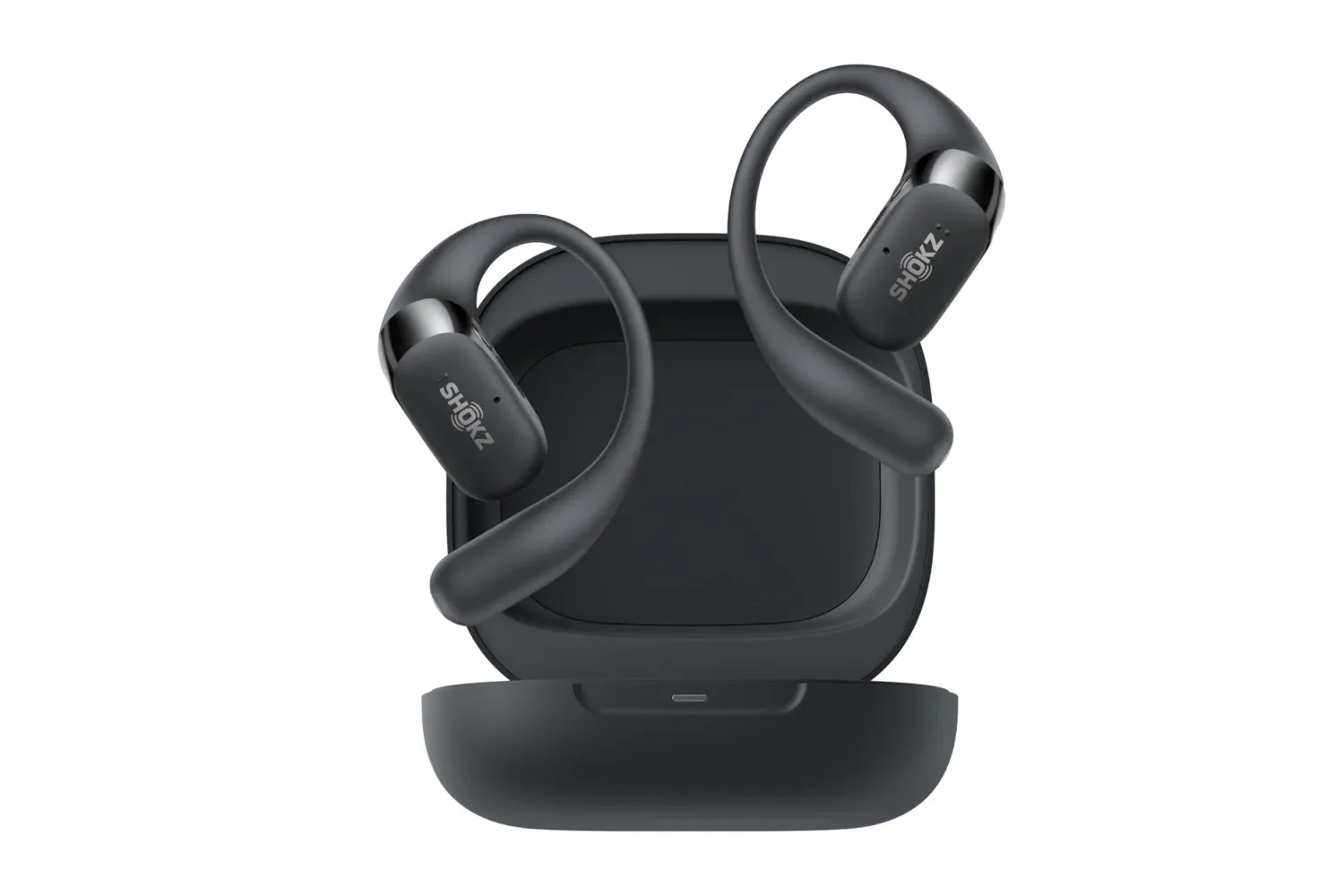 Shokz OpenFit 2 open-ear earbuds resting in their charging case