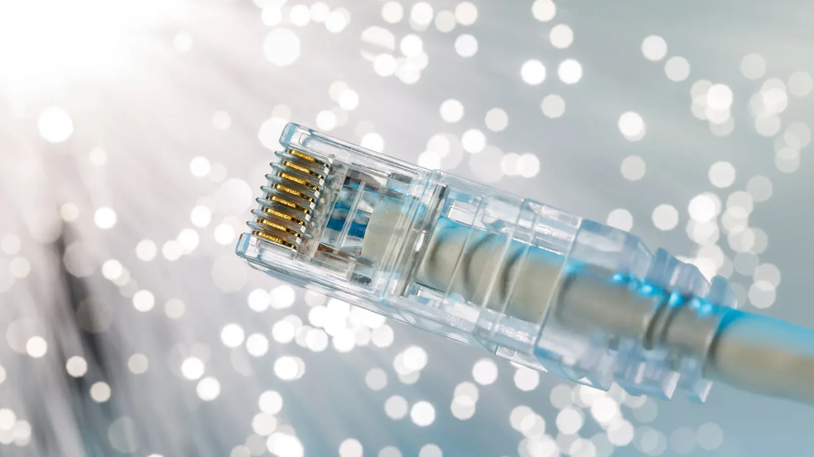 Ethernet cable connected to a desktop PC beside a router