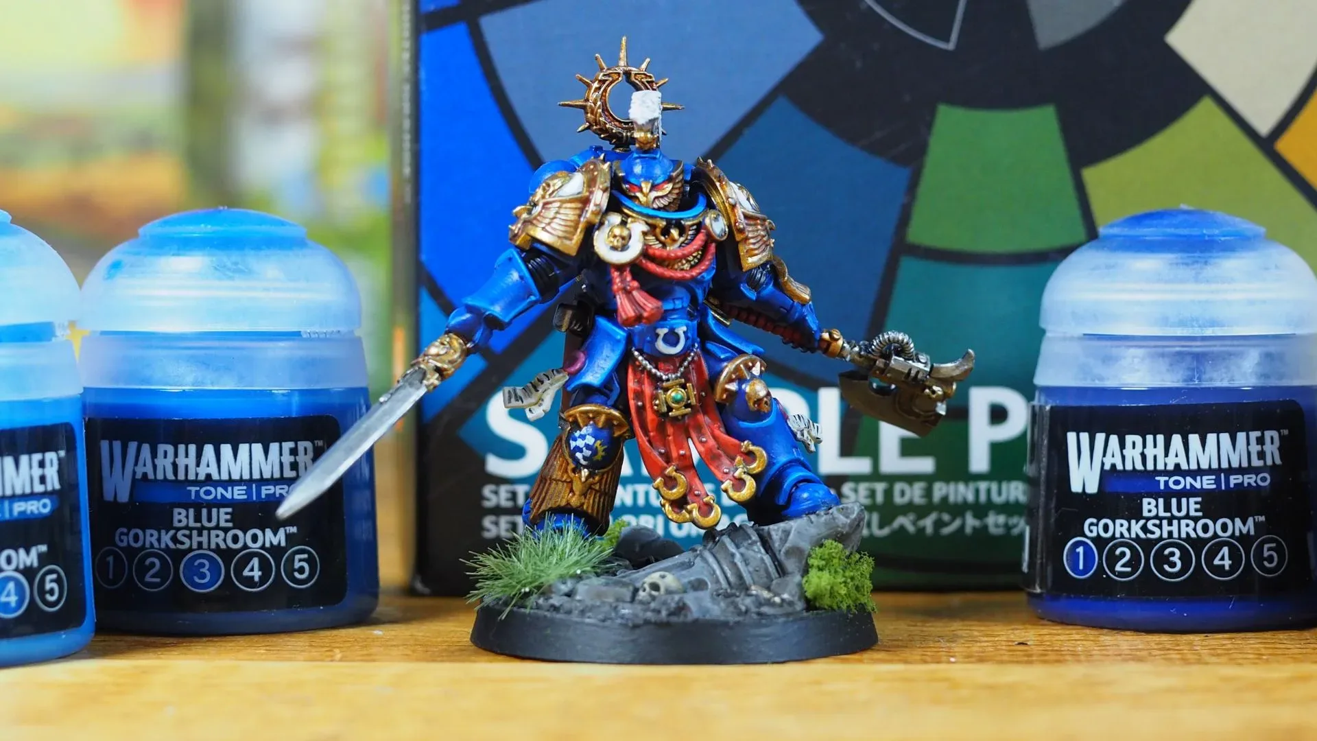 A painted Ultramarine miniature demonstrating layered blue armour shades