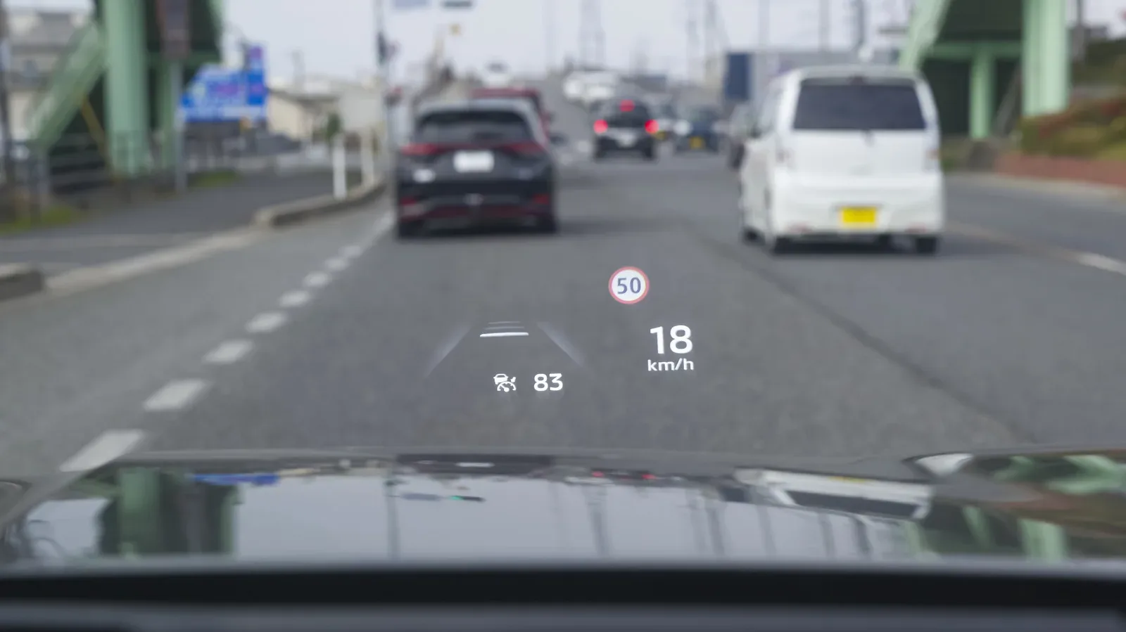 Front-mounted vehicle radar sensor behind a grille used for adaptive cruise control