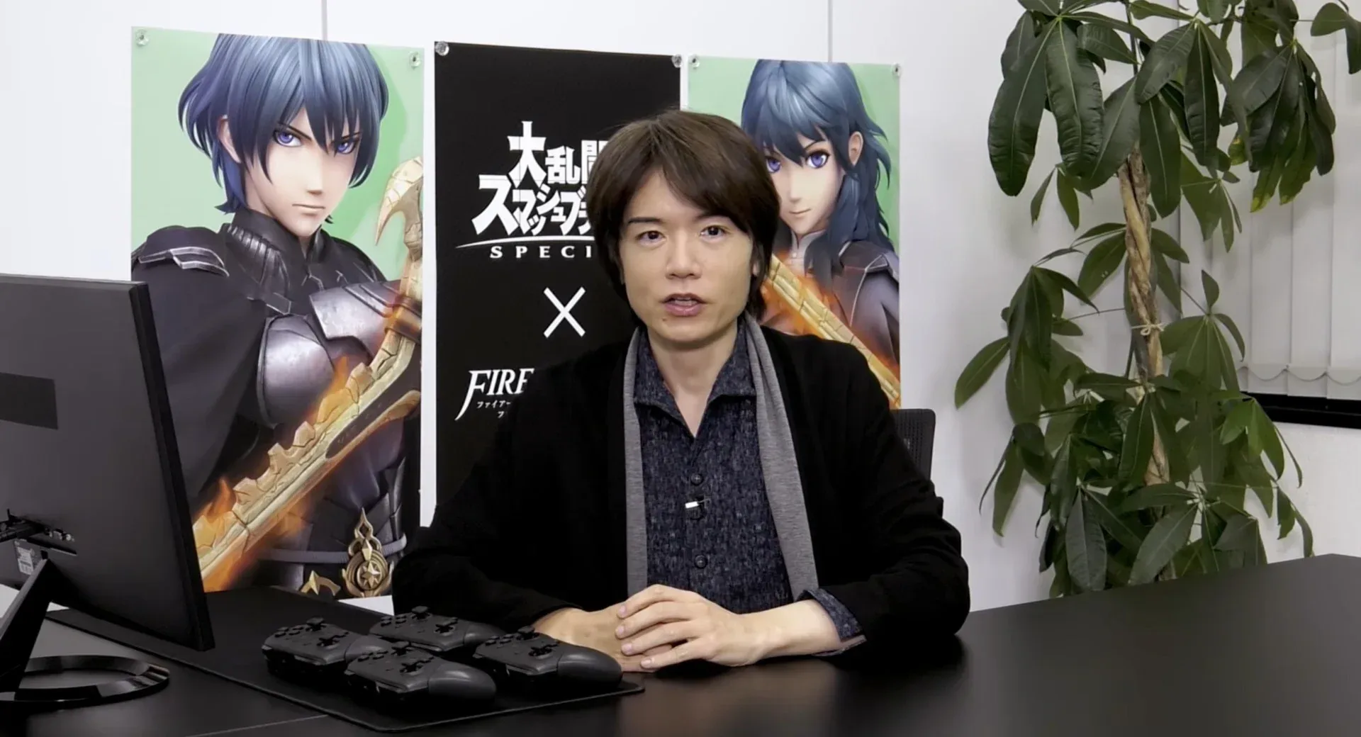 Masahiro Sakurai speaking about original game design at an industry event