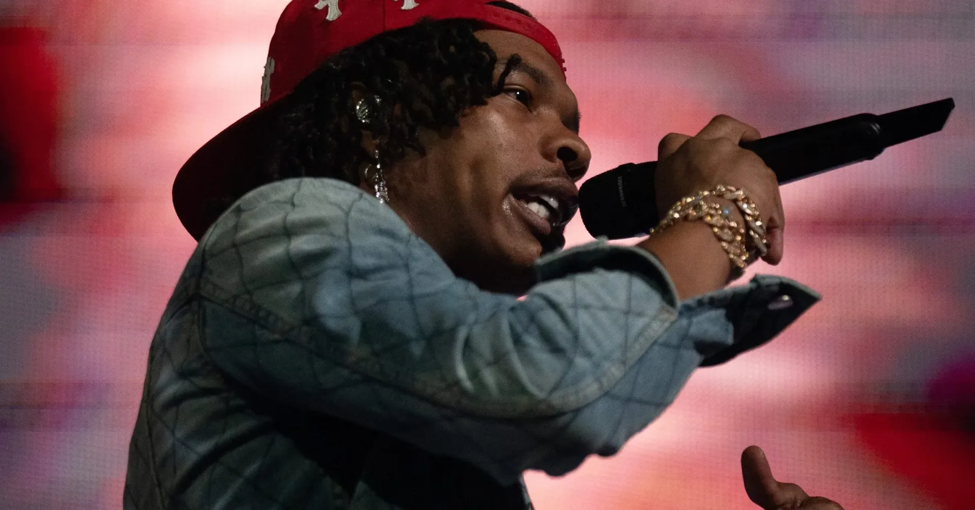 Lil Baby performing onstage during a live hip-hop set