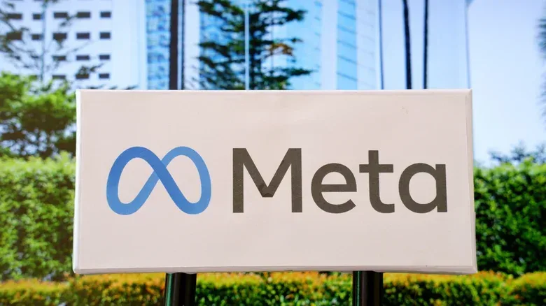Meta business terms shown on a screen with publisher website pages in the background