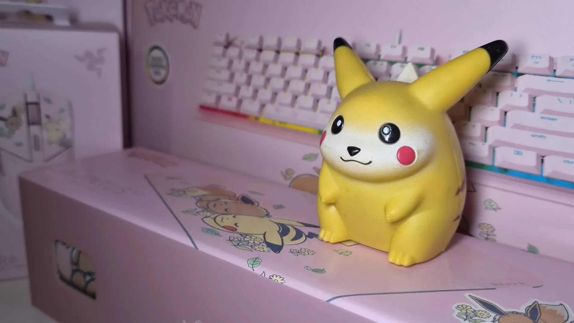 Razer Pikachu and Eevee Ornata V3 Tenkeyless keyboard with pink keys and illustrated palm rest