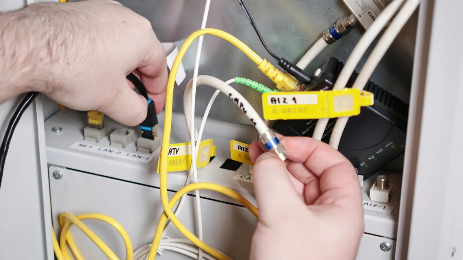 A home router and modem connected with Ethernet cables