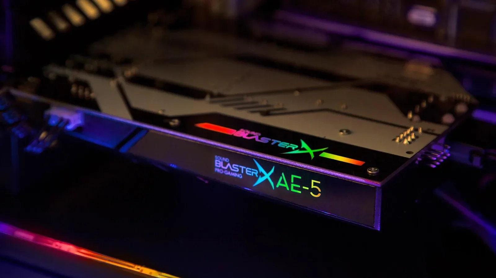 A desktop gaming PC motherboard audio ports beside headphones