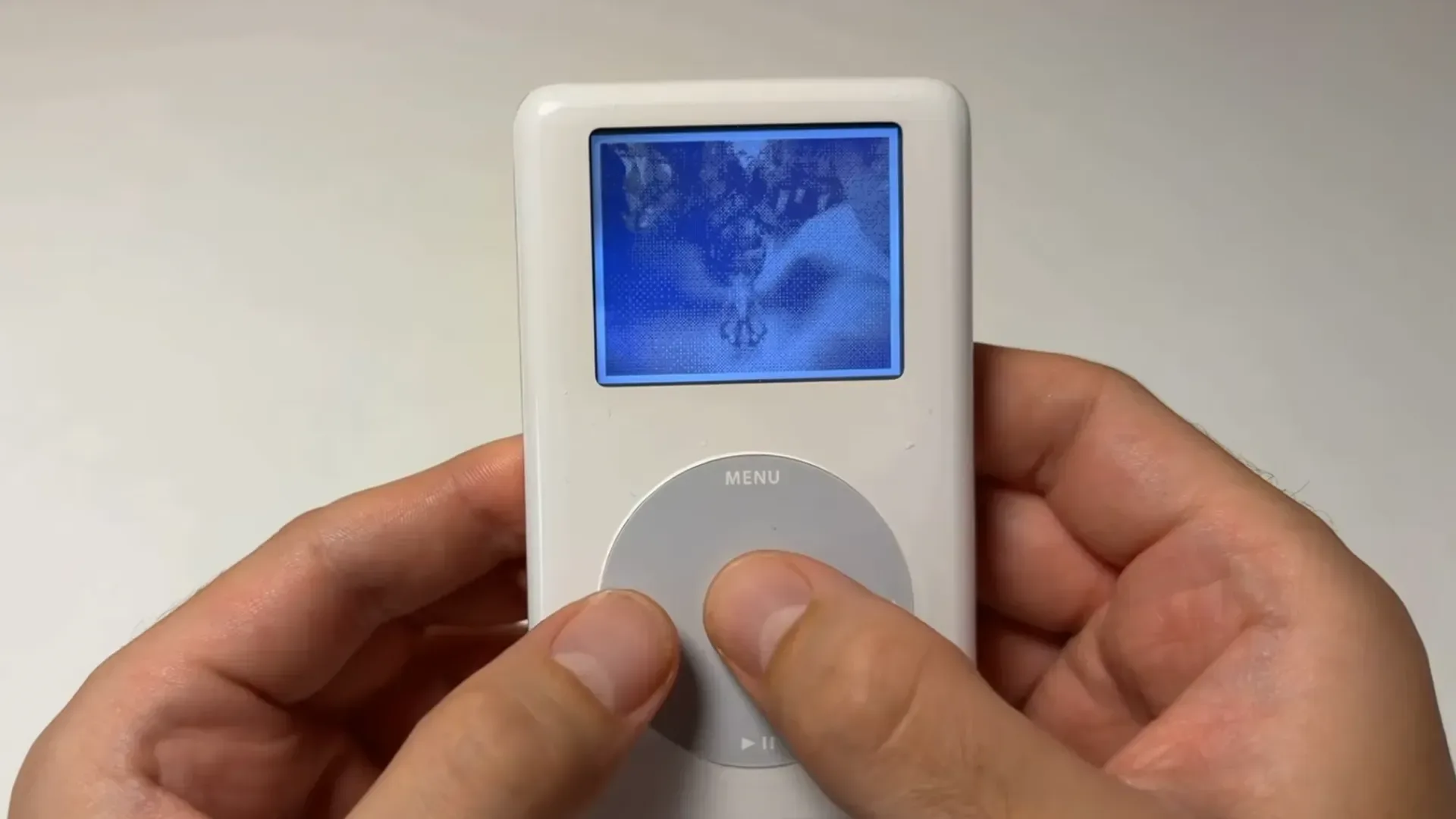 Classic iPod with click wheel and monochrome display fitted with modern Sprout board