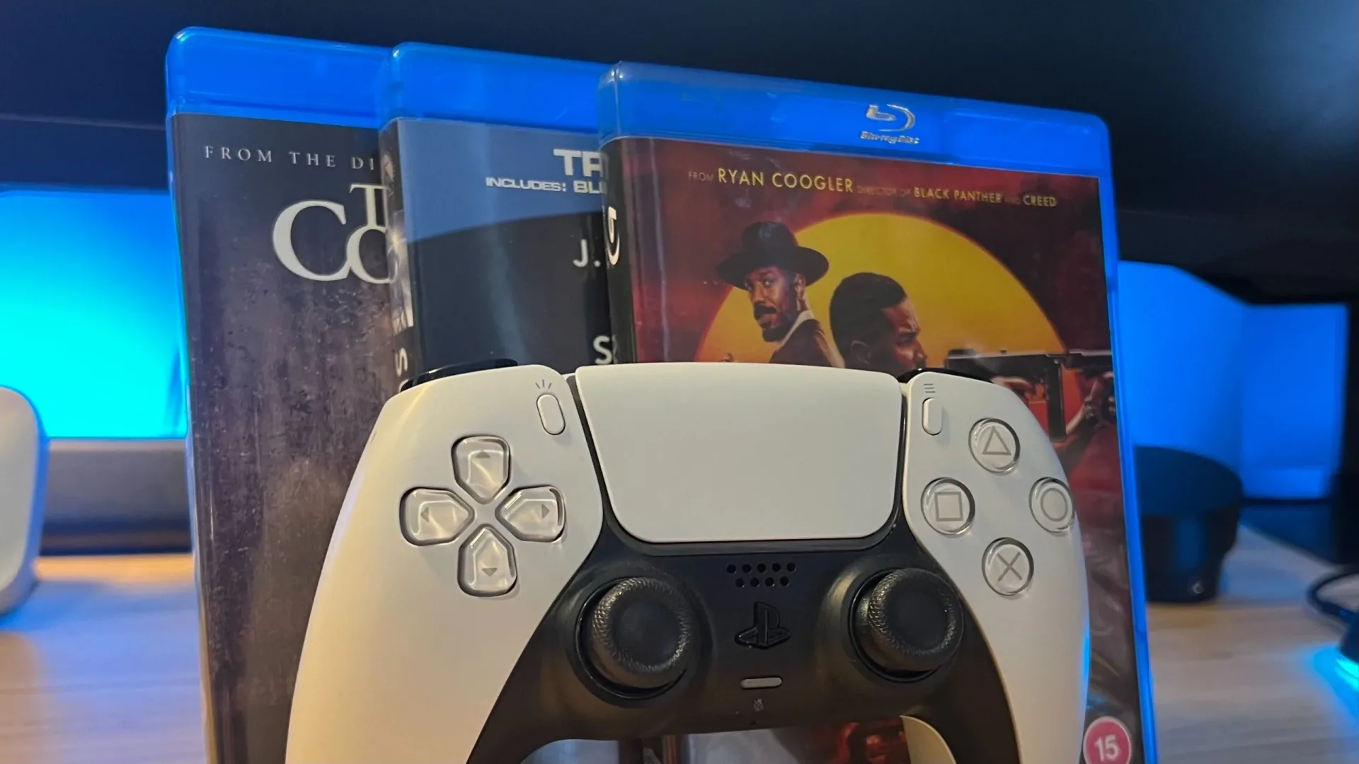 Sony PS5 Disc Edition console beside a Blu-ray disc case