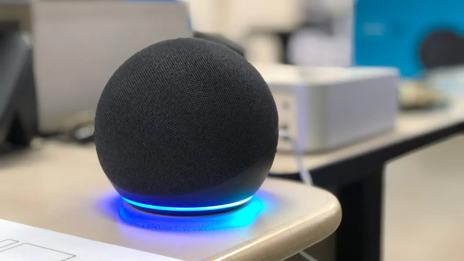A smart speaker positioned away from a wall in a quiet living room