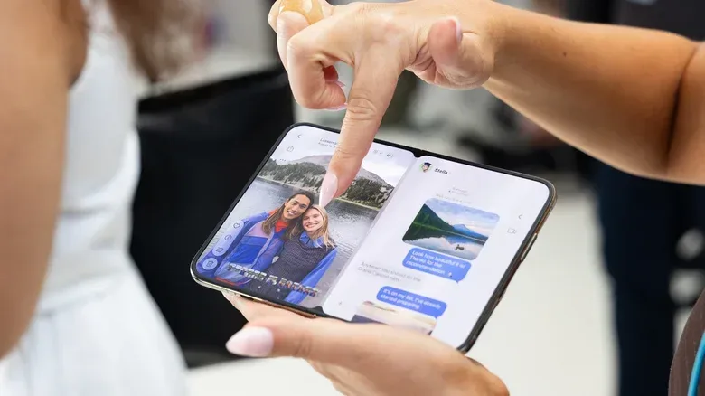 A partially folded phone standing in tent mode for hands-free viewing