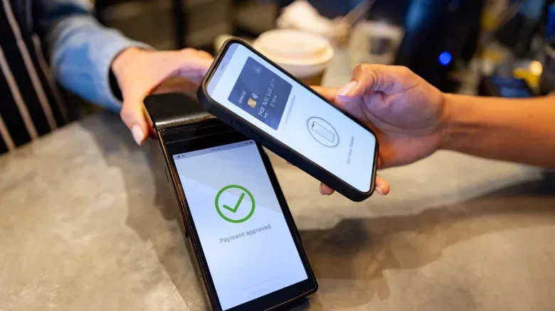 Digital wallet contactless payment being carried out.
