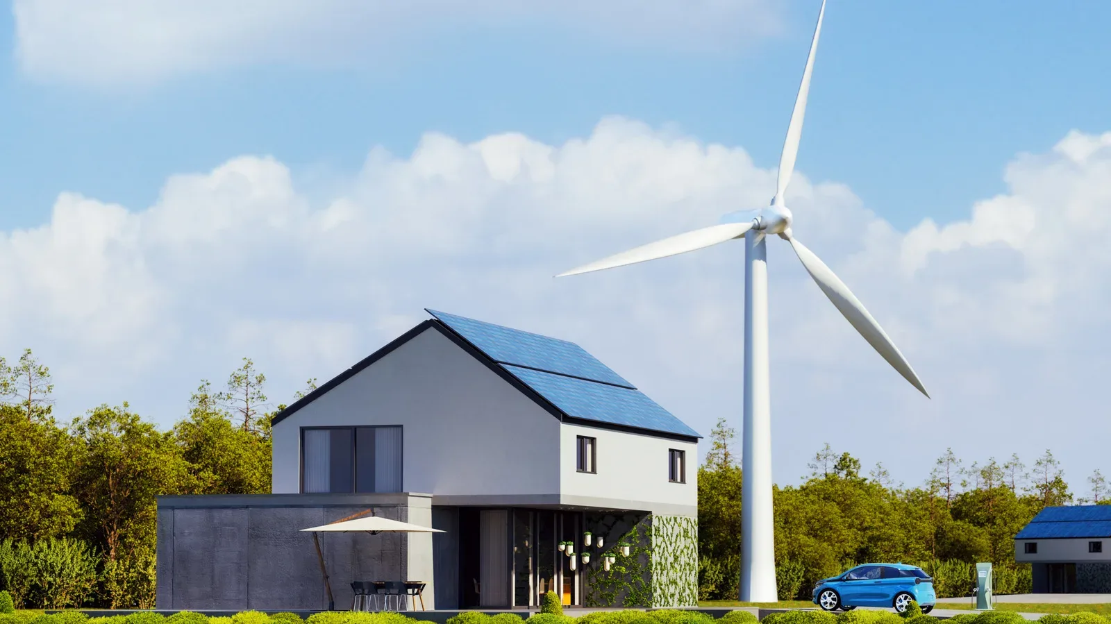 Small residential wind turbine on a tall tower above nearby trees