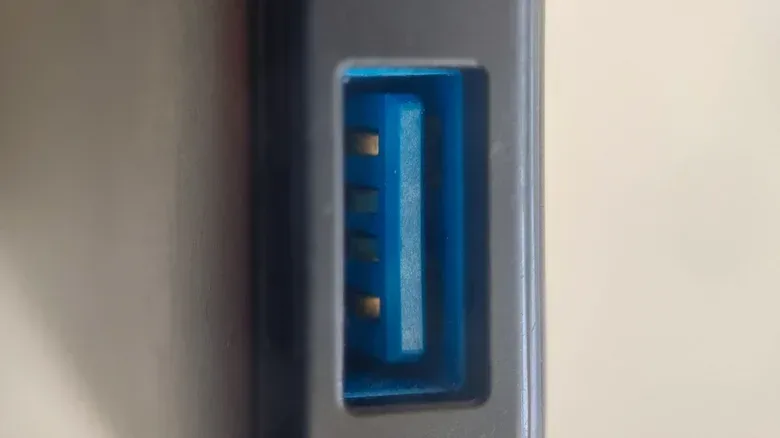 USB cable connected to an orange USB-A port