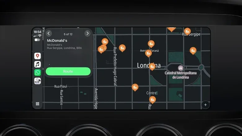 The TomTom app on CarPlay, showing the nearest fast food spots in a city.
