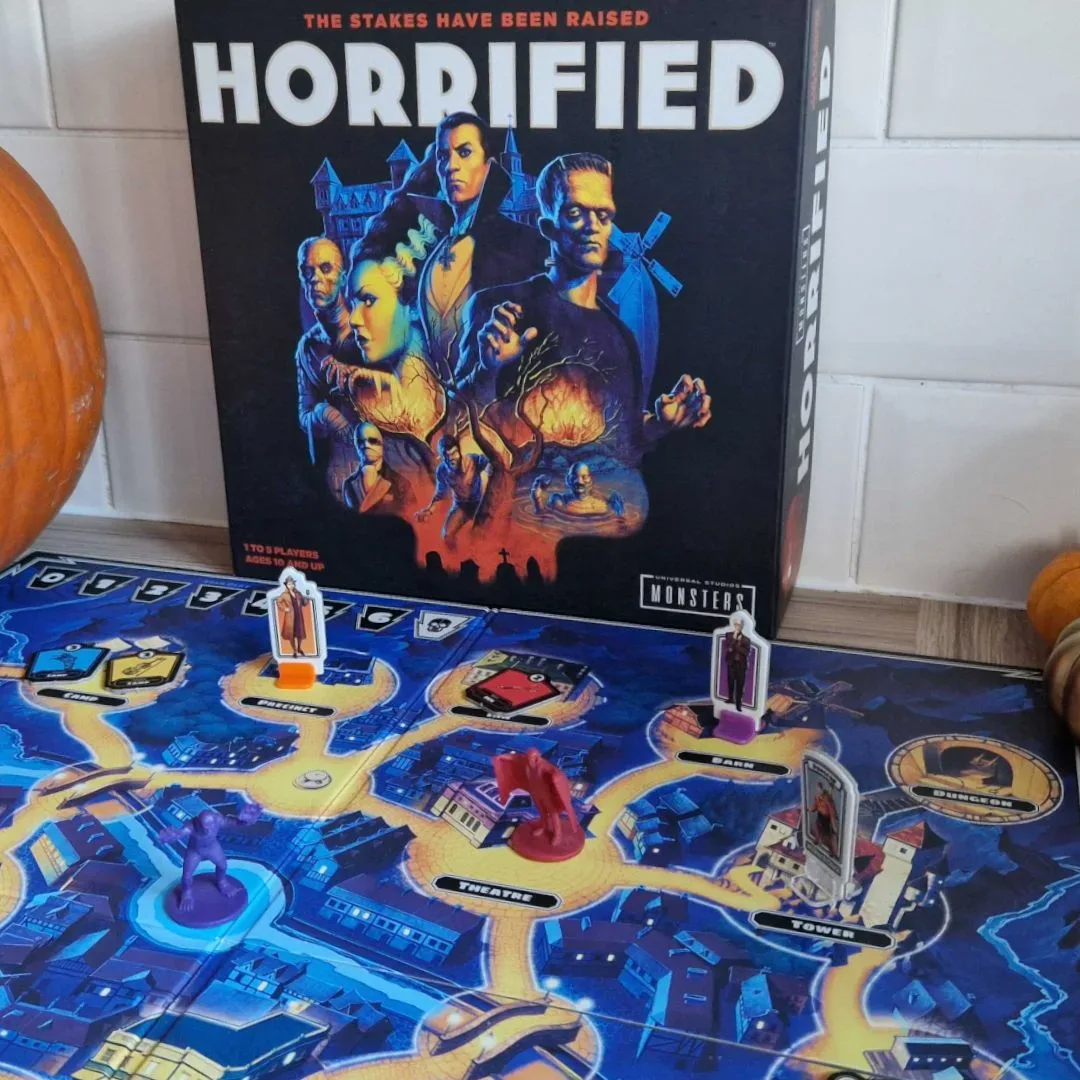 Players coordinating to rescue villagers and defeat monsters in Horrified