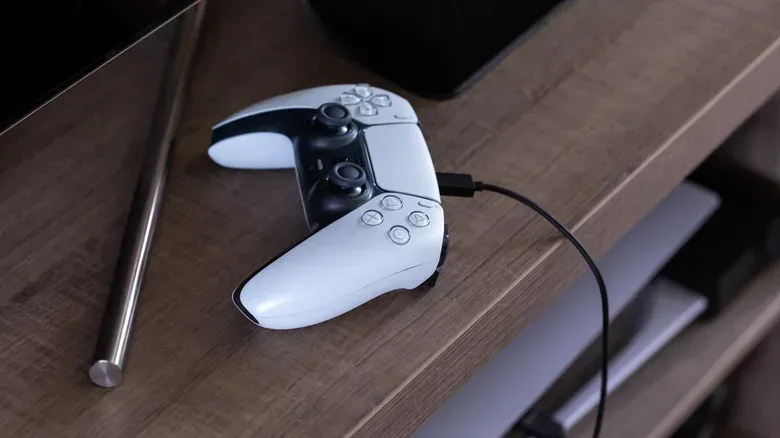 DualSense controller charging from a PS5 front USB port