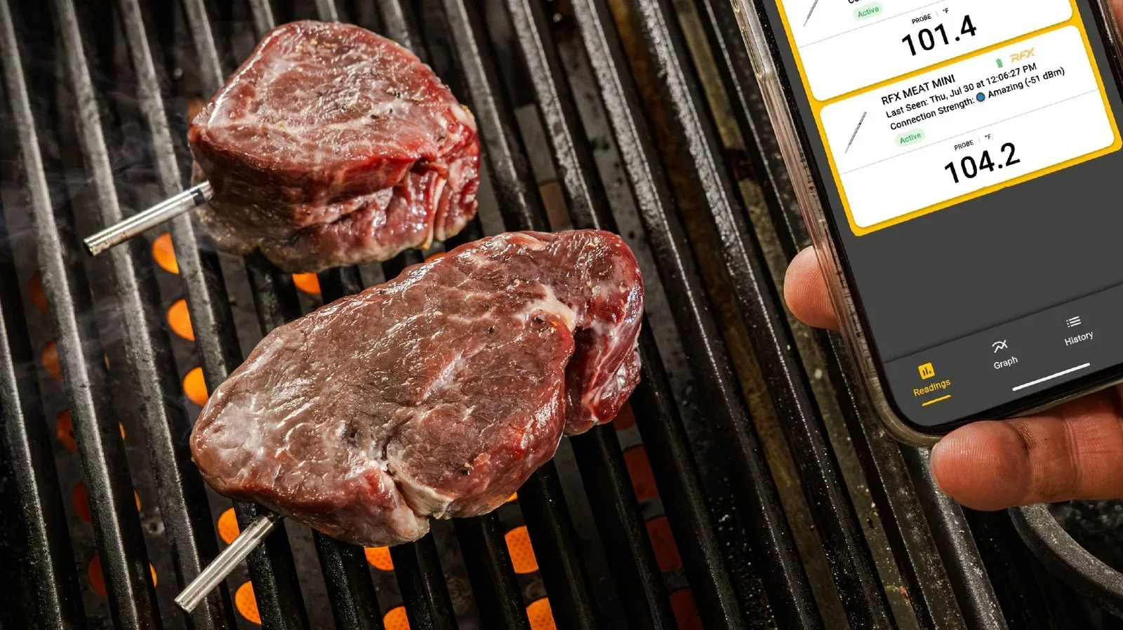 ThermoWorks RFX Meat Mini wireless temperature probe beside its charging block