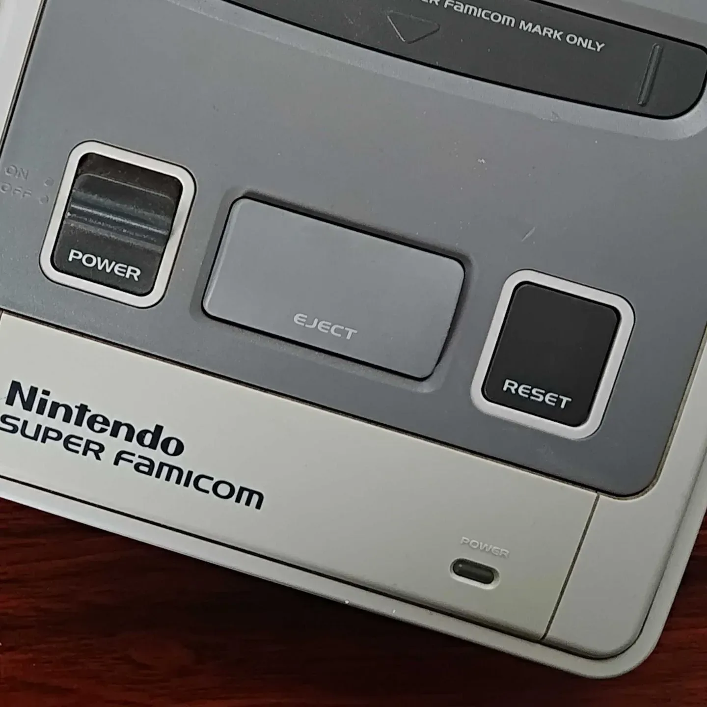Grey button design inspired by PAL Super Nintendo and Super Famicom hardware