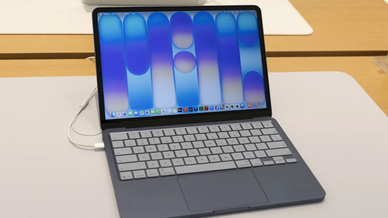 Apple MacBook Neo open beside a controller, illustrating its budget Mac gaming limitations