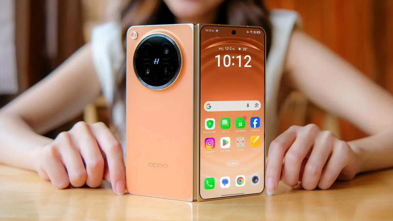 An imported foldable smartphone beside a US carrier SIM card