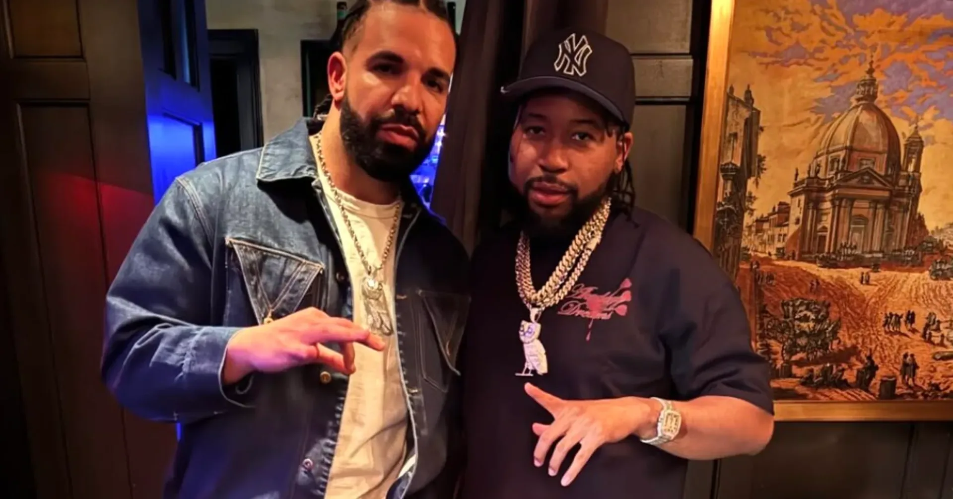DJ Akademiks wearing an OVO owl chain at a Miami event