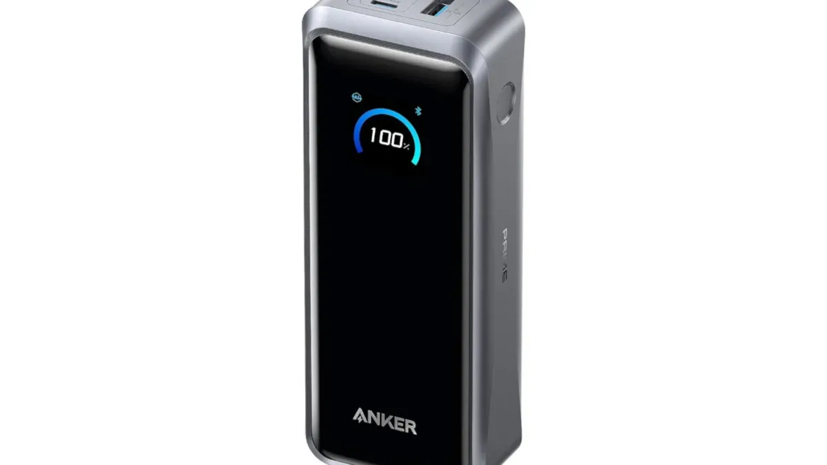 Portable charging setup with a handheld gaming PC, phone and laptop