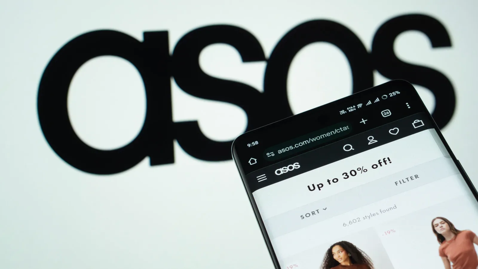 An Asos mobile app notification displayed on a smartphone