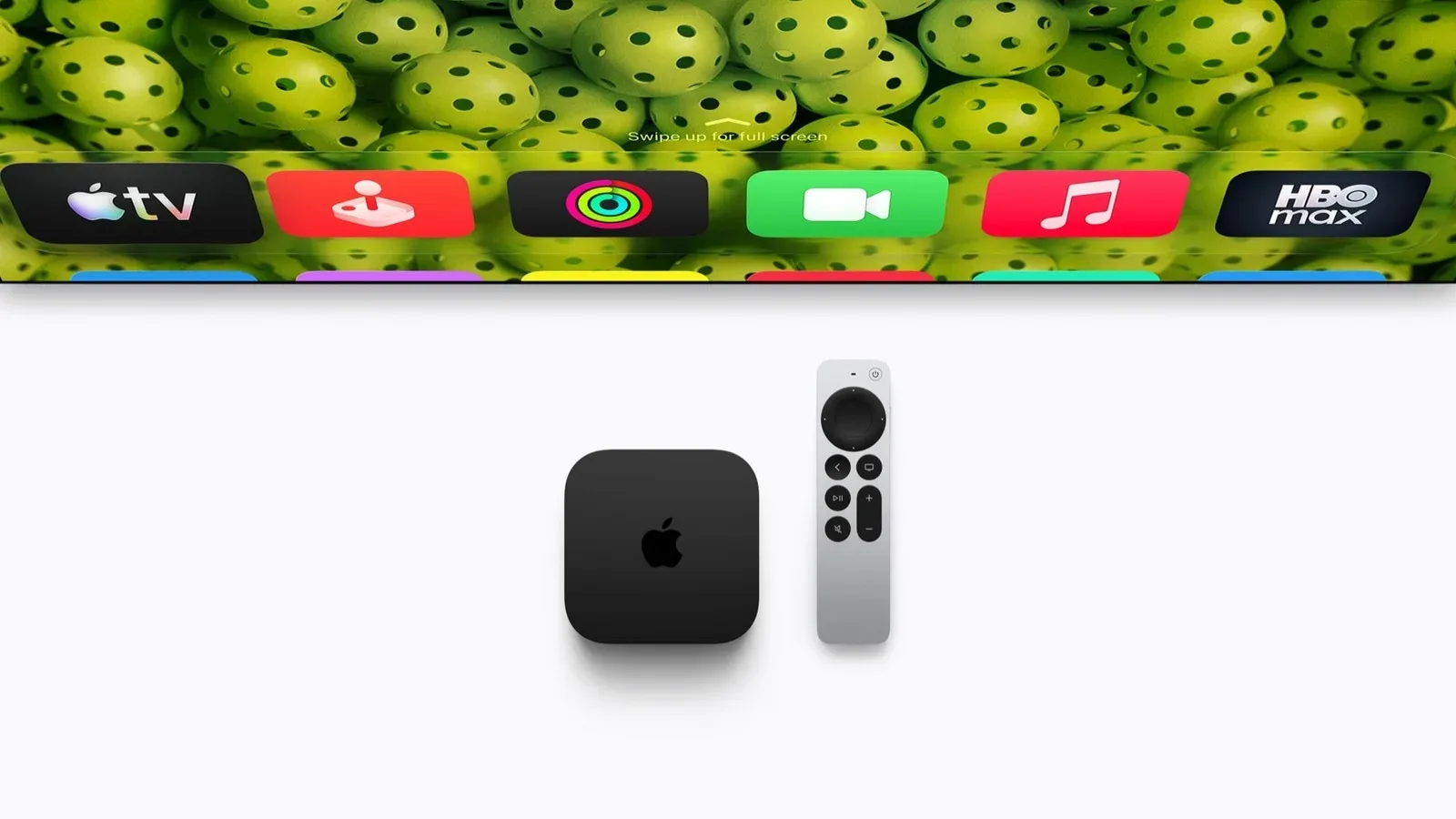 Apple TV 4K connected beneath a television with the Siri Remote in front