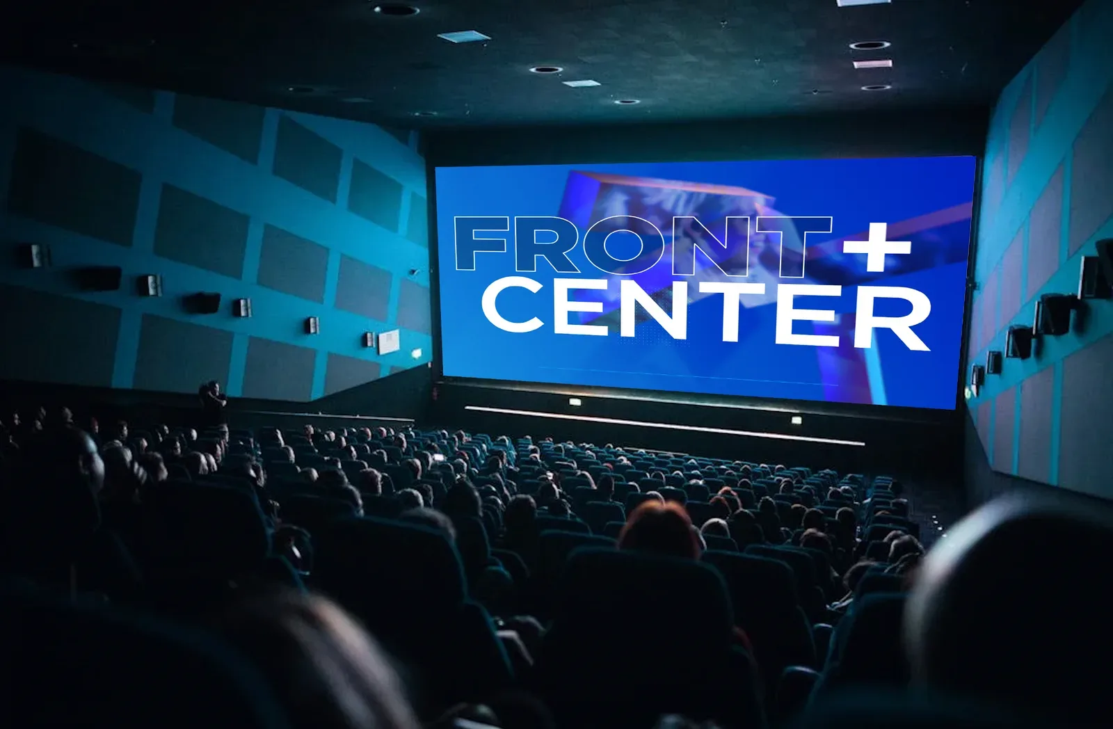A cinema auditorium screen displaying a pre-show before a movie