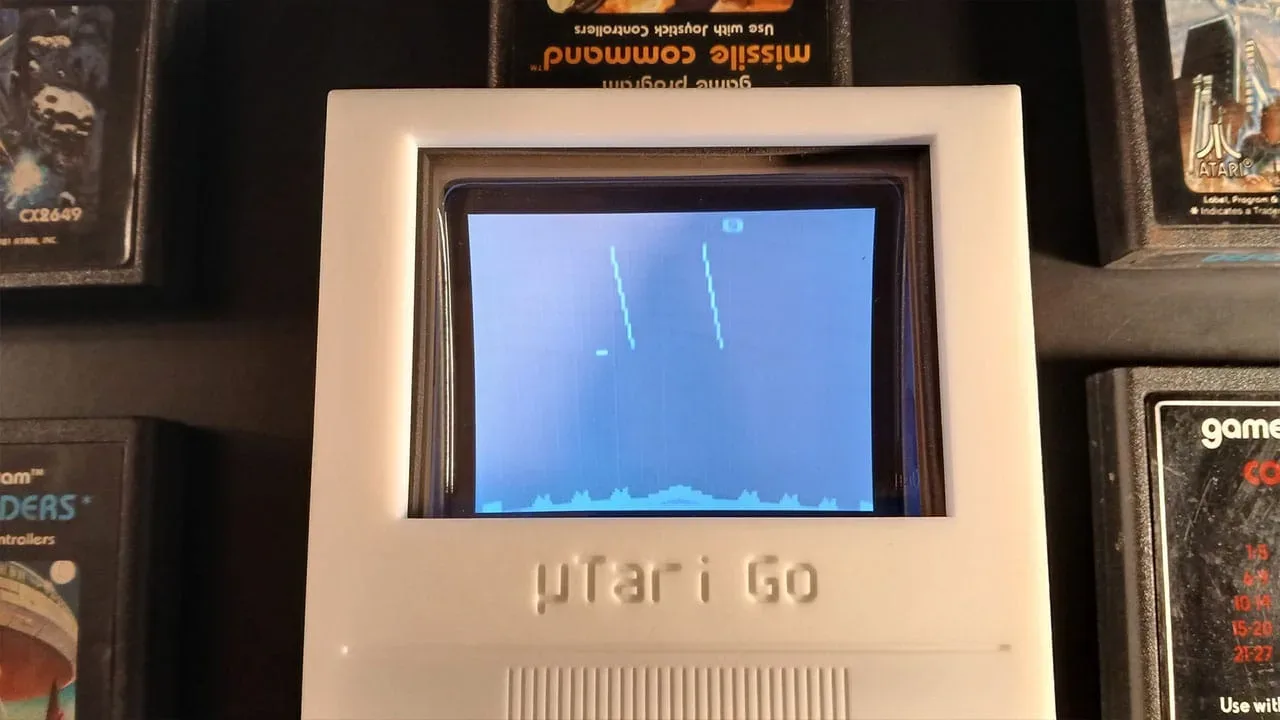 A 3D-printed µTari Go portable Atari 2600 hardware build using real cartridges