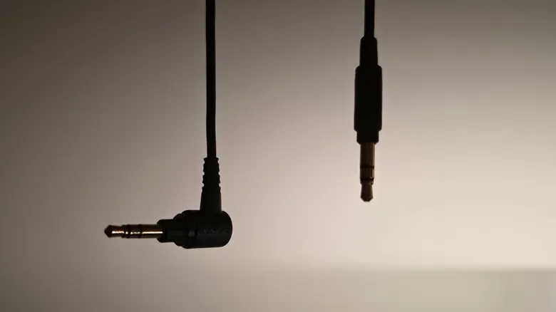Both ends of a 3.5mm headphone cable.