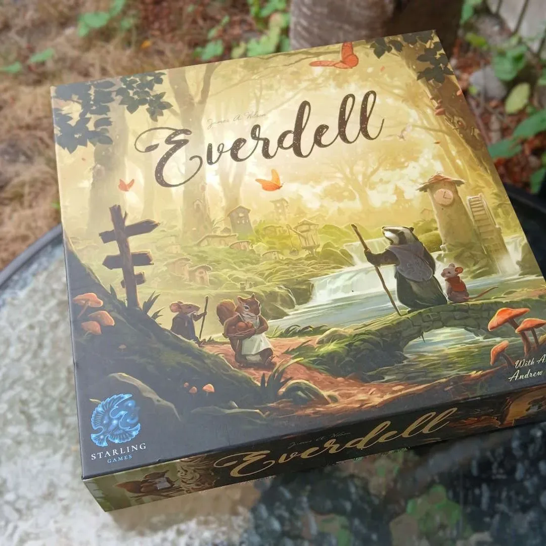 Ticket to Ride, Spirit Island and Everdell board game boxes displayed on a table