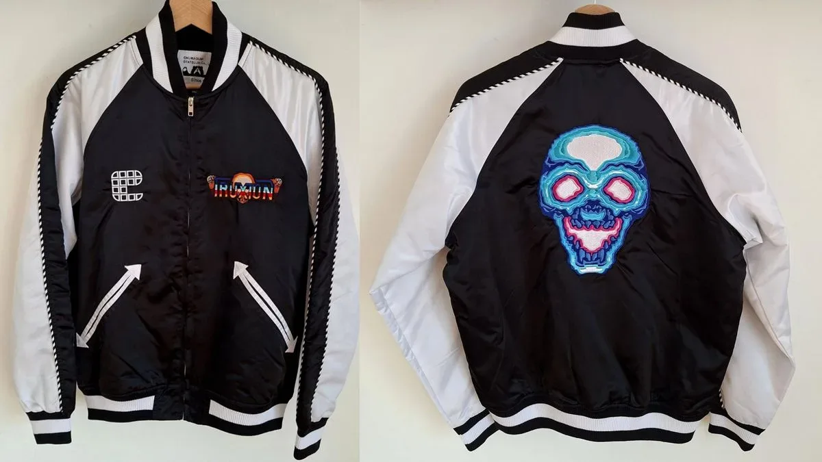 Back and front view of Kumagumi Truxton bomber jacket with skull embroidery on back.