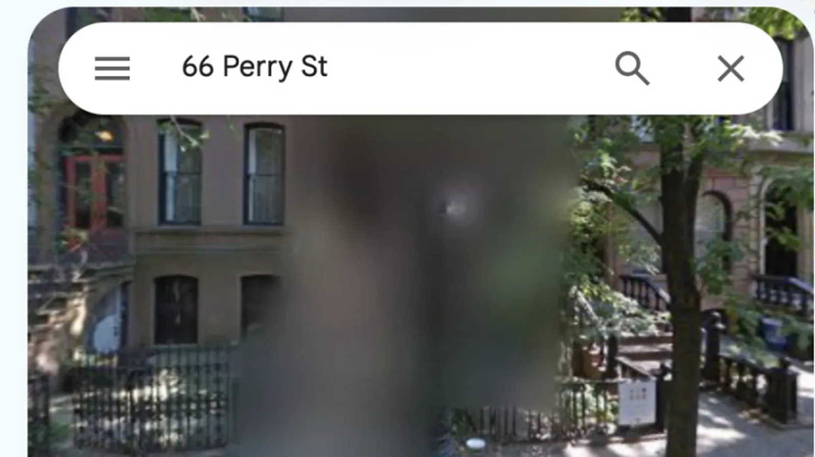 A Google Maps Street View home with the building obscured by a privacy blur