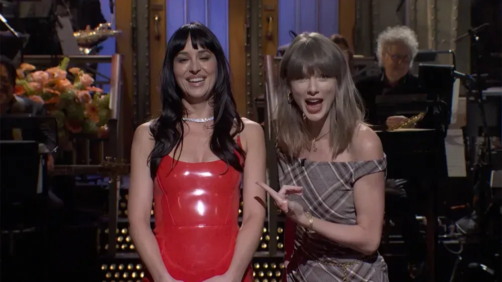 Taylor Swift Drops Into Dakota Johnson’s ‘SNL’ Monologue for a Therapist Bit and Birthday Cake