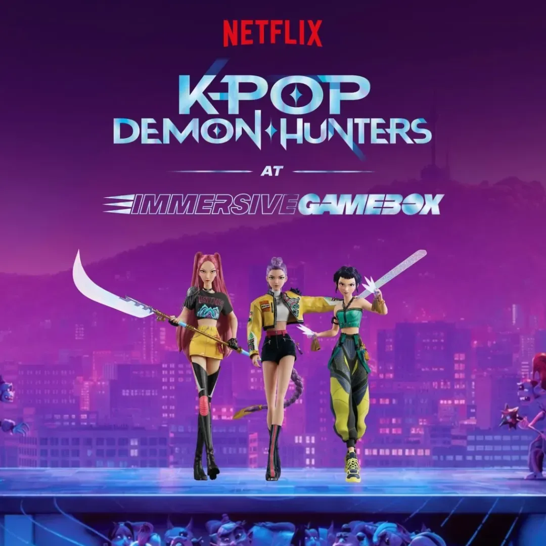 Players take part in an Immersive Gamebox KPop Demon Hunters experience using motion-tracked interactive room technology